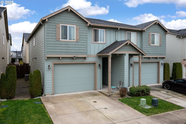 view of front facade featuring driveway, board and batten siding, a shingled roof, a garage, and central AC unit