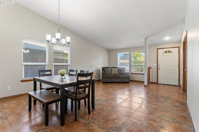 dining space featuring recessed lighting, an inviting chandelier, vaulted ceiling, and baseboards