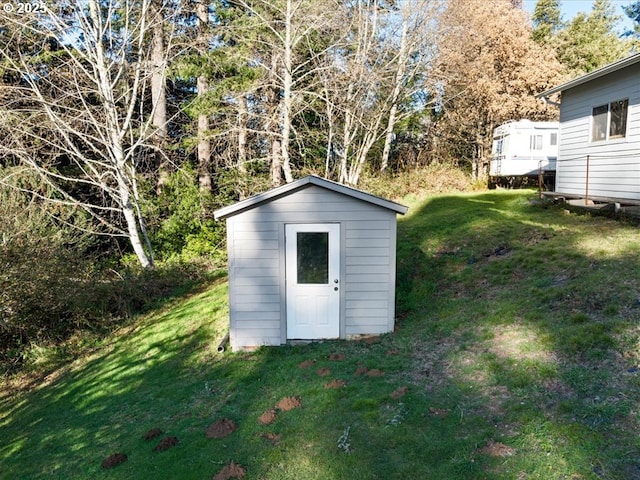 view of outdoor structure with a lawn