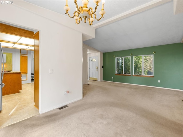 spare room with a chandelier, lofted ceiling with beams, and light carpet