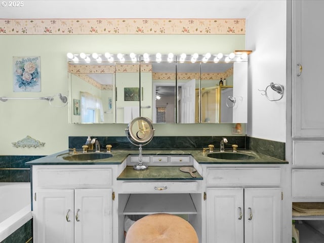 bathroom featuring vanity and separate shower and tub