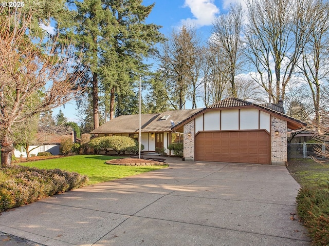 view of front facade featuring a garage and a front lawn