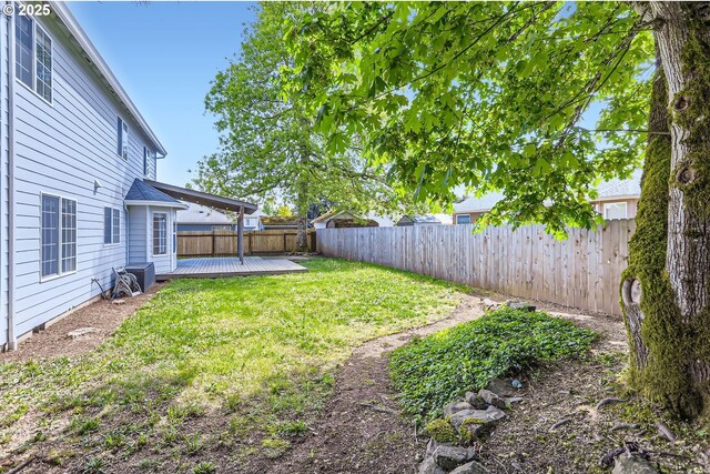 view of yard featuring a wooden deck
