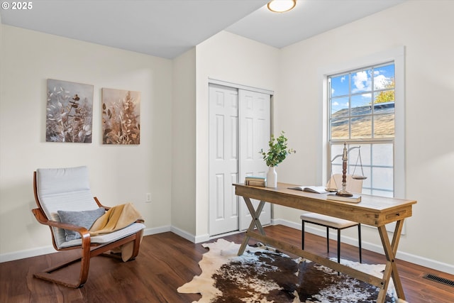 office space with dark hardwood / wood-style flooring