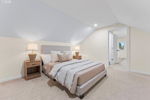 carpeted bedroom with vaulted ceiling