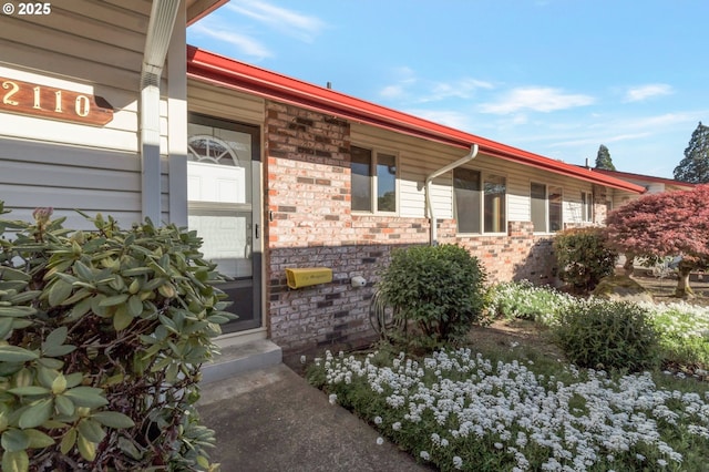 2110 SE 148th Pl, Portland, OR 97233 - property entrance featuring stone siding and covered porch