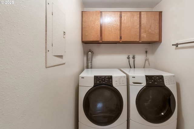 2110 SE 148th Pl, Portland, OR 97233 - laundry room featuring washing machine and dryer, cabinet space, and electric panel