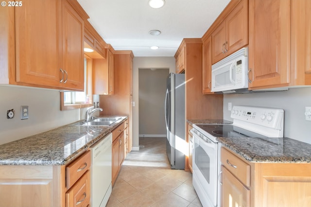 2110 SE 148th Pl, Portland, OR 97233 - kitchen with a sink, white appliances, light tile patterned floors, stone countertops, and recessed lighting