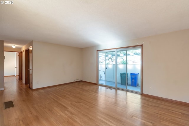 2110 SE 148th Pl, Portland, OR 97233 - unfurnished room featuring baseboards, light wood-style floors, and visible vents