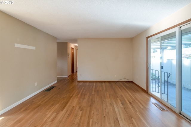 2110 SE 148th Pl, Portland, OR 97233 - unfurnished room with baseboards, light wood-style floors, and visible vents