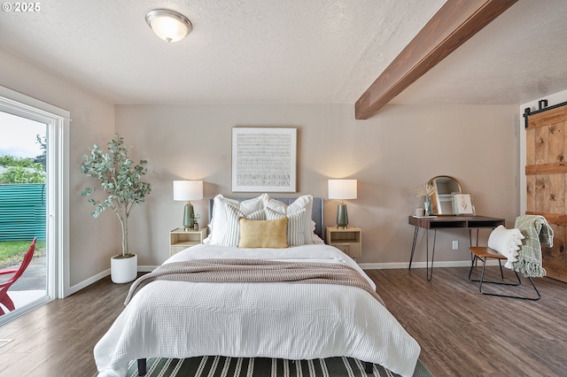 bedroom with a barn door, wood finished floors, a textured ceiling, access to outside, and baseboards
