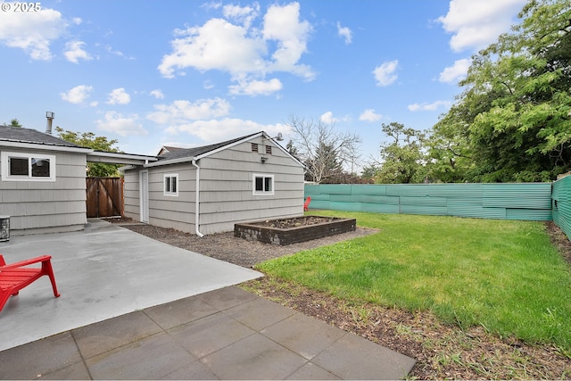 view of yard featuring a patio area and an outbuilding