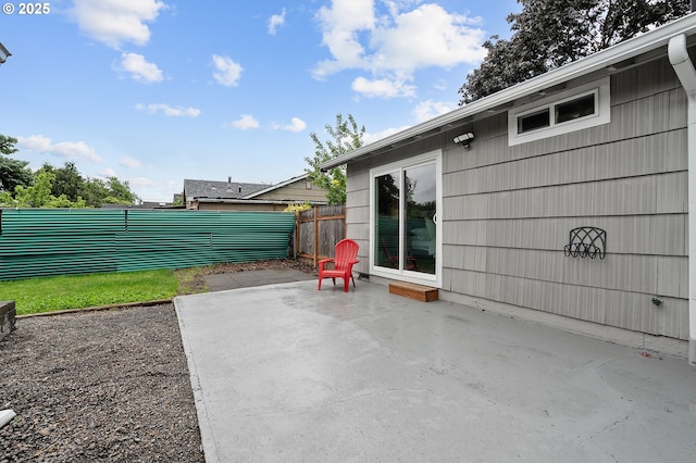 view of patio featuring fence