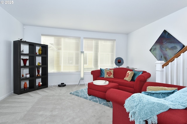 carpeted living room featuring baseboards