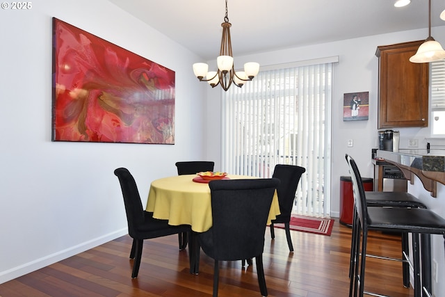 dining space with recessed lighting, baseboards, dark wood finished floors, and a chandelier