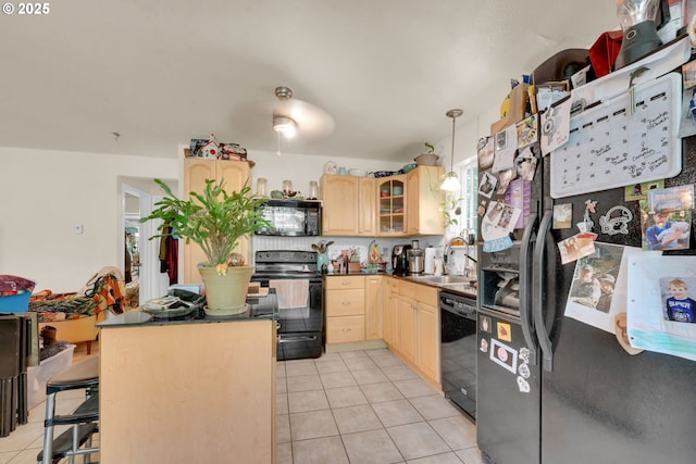 25761 Feather Dr, Veneta, OR 97487 - kitchen featuring black appliances, light brown cabinetry, a sink, and light tile patterned floors