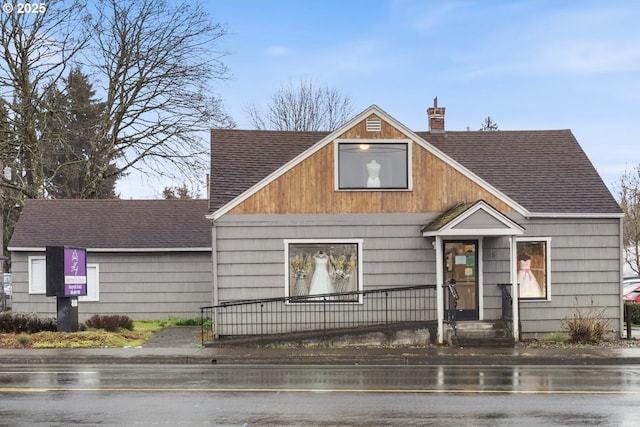 818 NE Division St, Gresham, OR 97030 - view of front of property with a shingled roof and a chimney