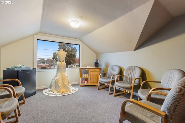 818 NE Division St, Gresham, OR 97030 - sitting room featuring vaulted ceiling, carpet, baseboards, and a textured ceiling