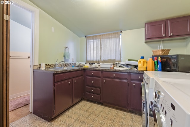 818 NE Division St, Gresham, OR 97030 - kitchen featuring reddish brown cabinets, washer and dryer, lofted ceiling, and a sink