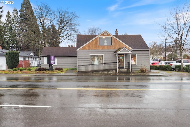818 NE Division St, Gresham, OR 97030 - view of front facade with a shingled roof, a fenced front yard, and a chimney