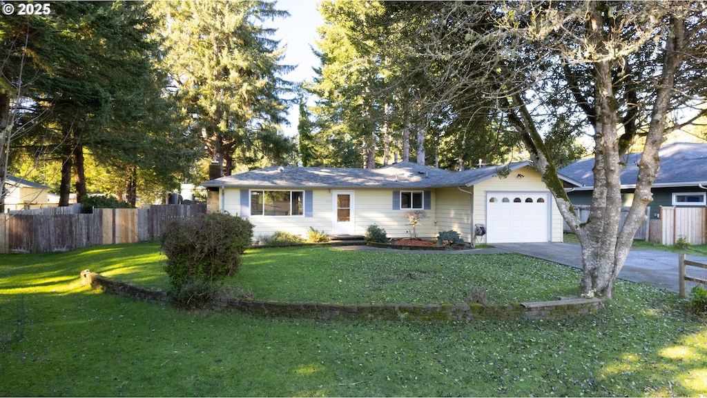 single story home with a garage and a front yard