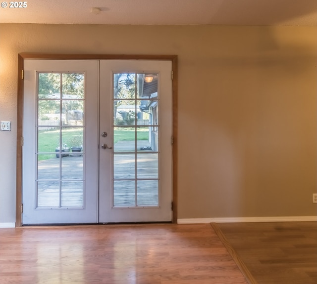 doorway to outside with french doors and hardwood / wood-style flooring