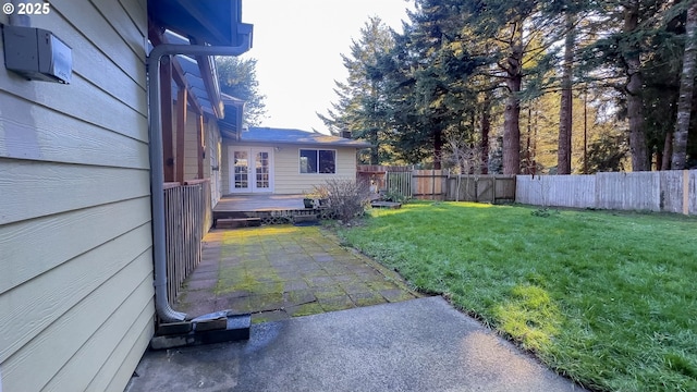 view of yard featuring french doors and a patio area