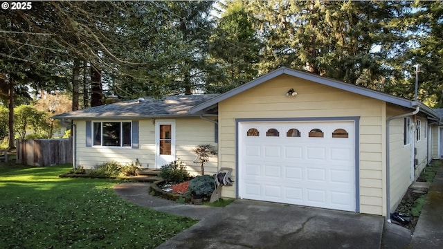 ranch-style house featuring a front lawn and a garage