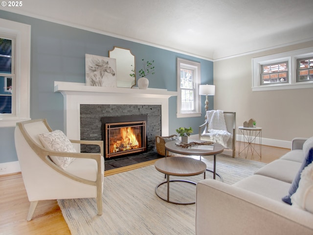 4214 NE Hassalo St, Portland, OR 97213 - living room with a stone fireplace, wood finished floors, and crown molding