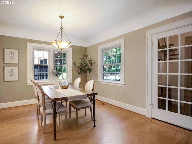 4214 NE Hassalo St, Portland, OR 97213 - dining space with healthy amount of natural light and light wood-style floors