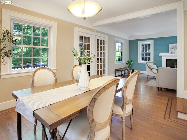 4214 NE Hassalo St, Portland, OR 97213 - dining room with wood finished floors, beam ceiling, a fireplace, and french doors