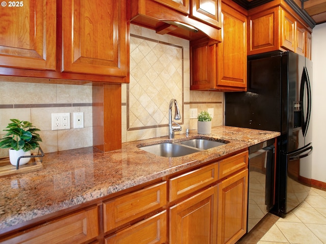 4214 NE Hassalo St, Portland, OR 97213 - kitchen featuring dishwasher, brown cabinets, light stone counters, light tile patterned floors, and decorative backsplash