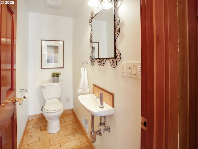 4214 NE Hassalo St, Portland, OR 97213 - half bath featuring toilet and tile patterned flooring