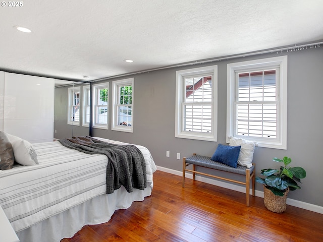 4214 NE Hassalo St, Portland, OR 97213 - bedroom featuring wood-type flooring, a textured ceiling, and recessed lighting