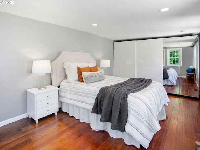 4214 NE Hassalo St, Portland, OR 97213 - bedroom featuring dark wood-style flooring and recessed lighting