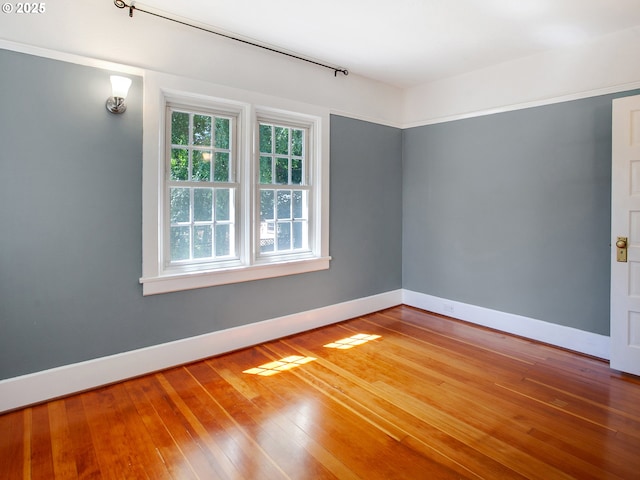 4214 NE Hassalo St, Portland, OR 97213 - unfurnished room with baseboards and hardwood / wood-style floors
