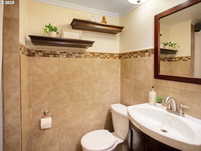 4214 NE Hassalo St, Portland, OR 97213 - bathroom with tile walls, vanity, and ornamental molding