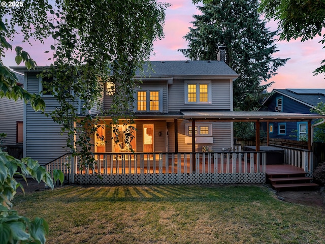 4214 NE Hassalo St, Portland, OR 97213 - view of front of house featuring a lawn, a chimney, and a wooden deck