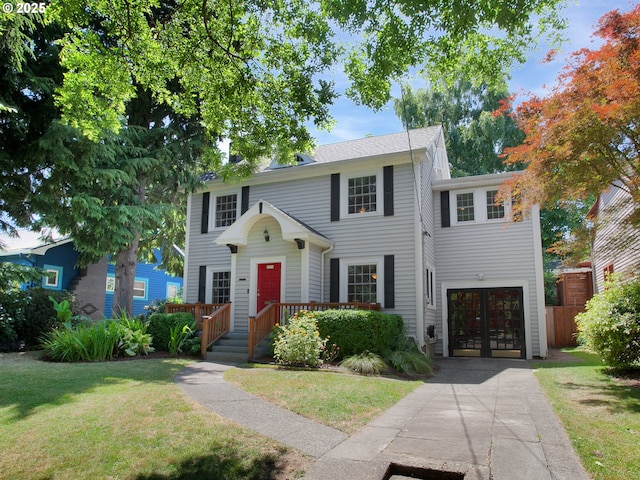 4214 NE Hassalo St, Portland, OR 97213 - colonial inspired home with driveway, a front lawn, an attached garage, and french doors