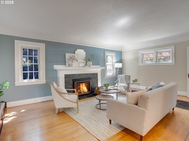 4214 NE Hassalo St, Portland, OR 97213 - living room with ornamental molding, a fireplace, and wood finished floors