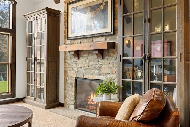 interior space with a fireplace and baseboards