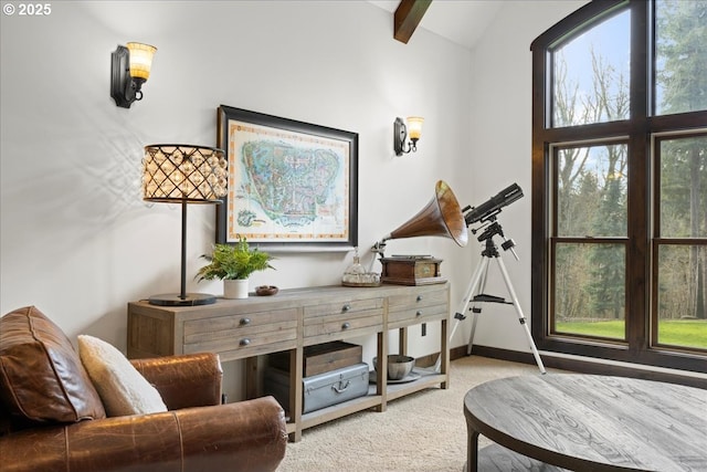 sitting room with carpet, baseboards, and vaulted ceiling