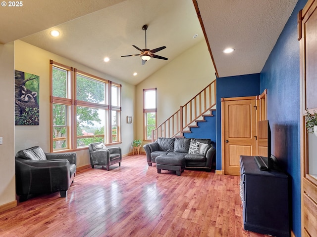 111 5th St, Silverton, OR 97381 - living area featuring light wood-style flooring, ceiling fan, stairs, baseboards, and recessed lighting