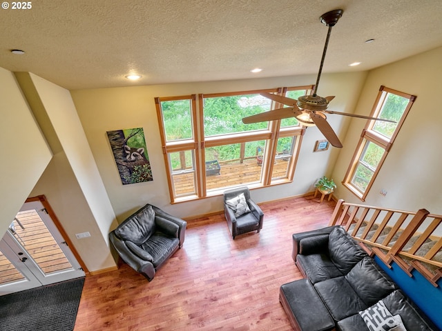 111 5th St, Silverton, OR 97381 - living room with wood finished floors, a textured ceiling, ceiling fan, recessed lighting, and baseboards