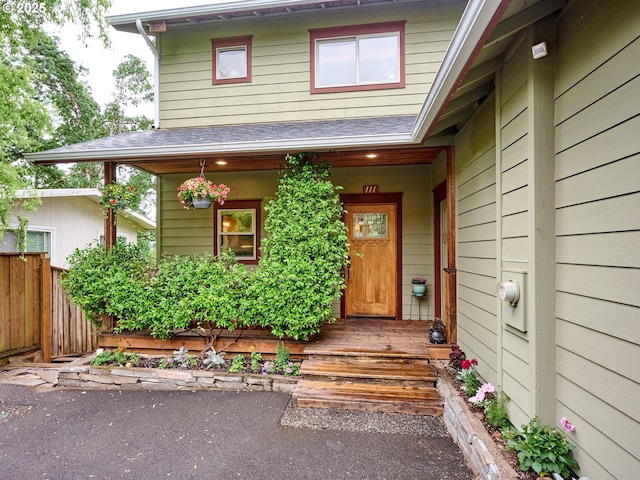 111 5th St, Silverton, OR 97381 - view of exterior entry with roof with shingles and covered porch