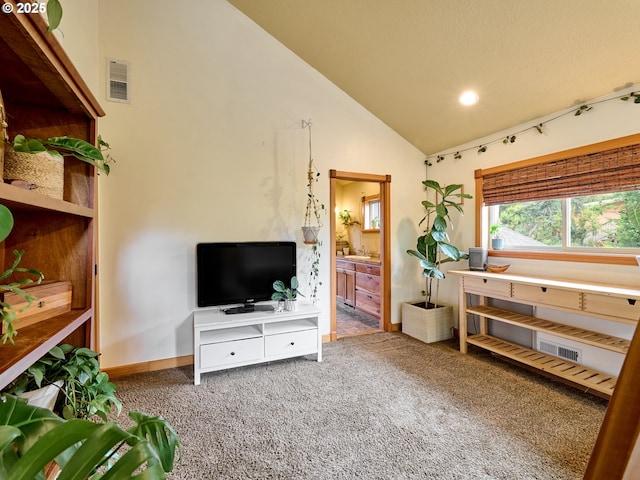 111 5th St, Silverton, OR 97381 - living area with carpet floors, baseboards, recessed lighting, and high vaulted ceiling