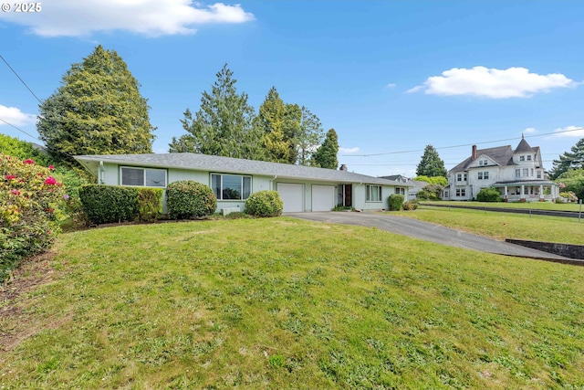 110 N Dean St, Coquille, OR 97423 - view of front of house featuring a garage, asphalt driveway, and a front yard