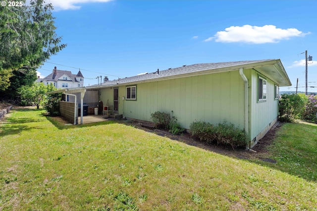 110 N Dean St, Coquille, OR 97423 - back of property with a patio and a lawn