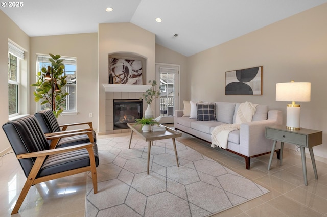 30326 SW Ruth St Unit 58, Wilsonville, OR 97070 - living area with light tile patterned floors, a tiled fireplace, lofted ceiling, visible vents, and recessed lighting