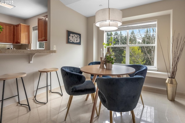 30326 SW Ruth St Unit 58, Wilsonville, OR 97070 - dining area featuring baseboards and light tile patterned floors